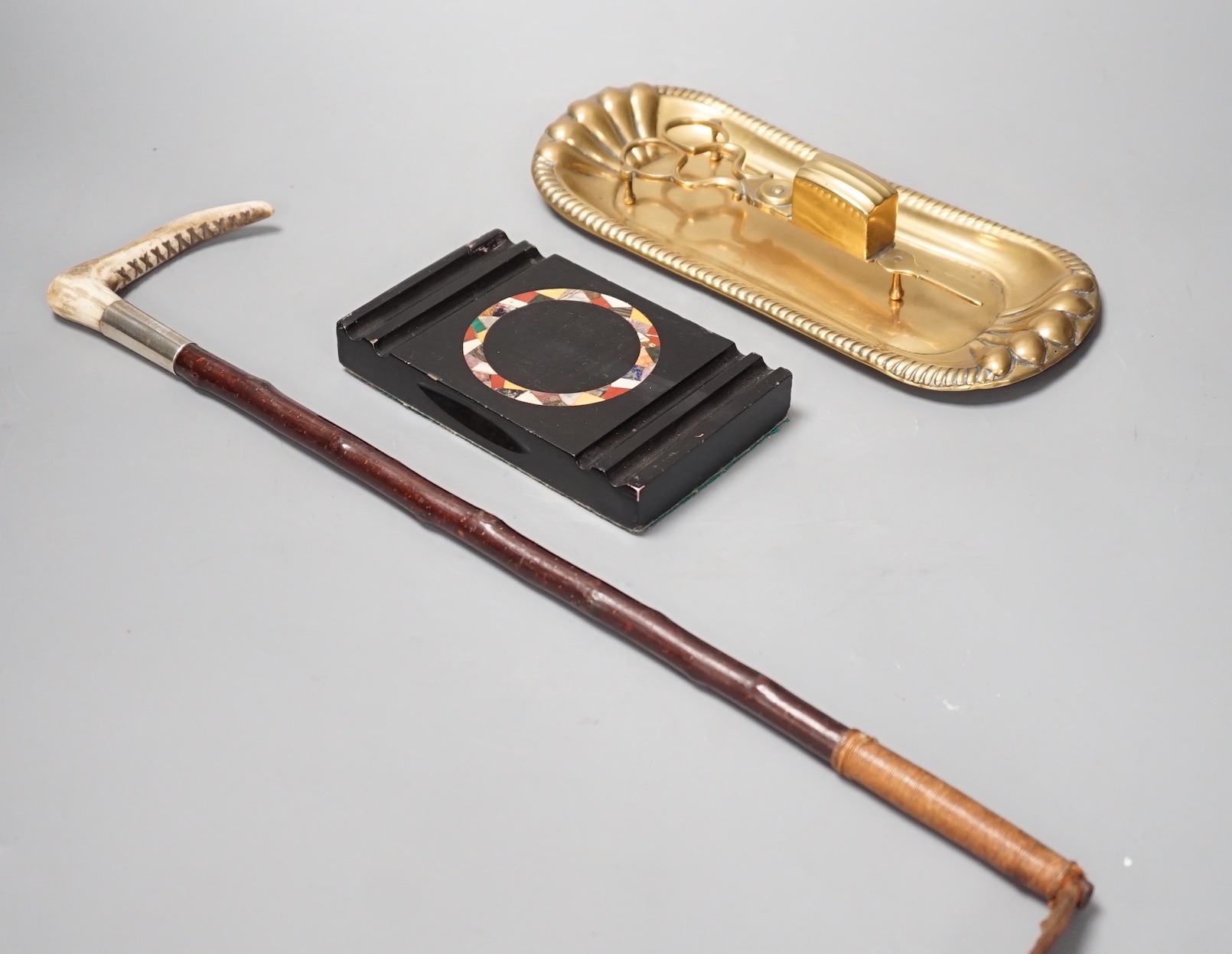 A pair of 19th century candle snuffers and tray, a hardstone paperweight and a crop